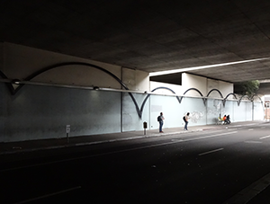 Image of 40th Street underpass adjacent to MacArthur station looking very dark and uninviting