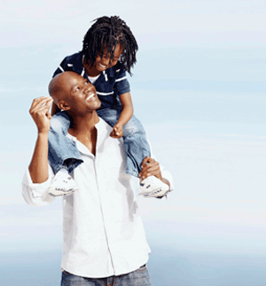child on man's shoulders