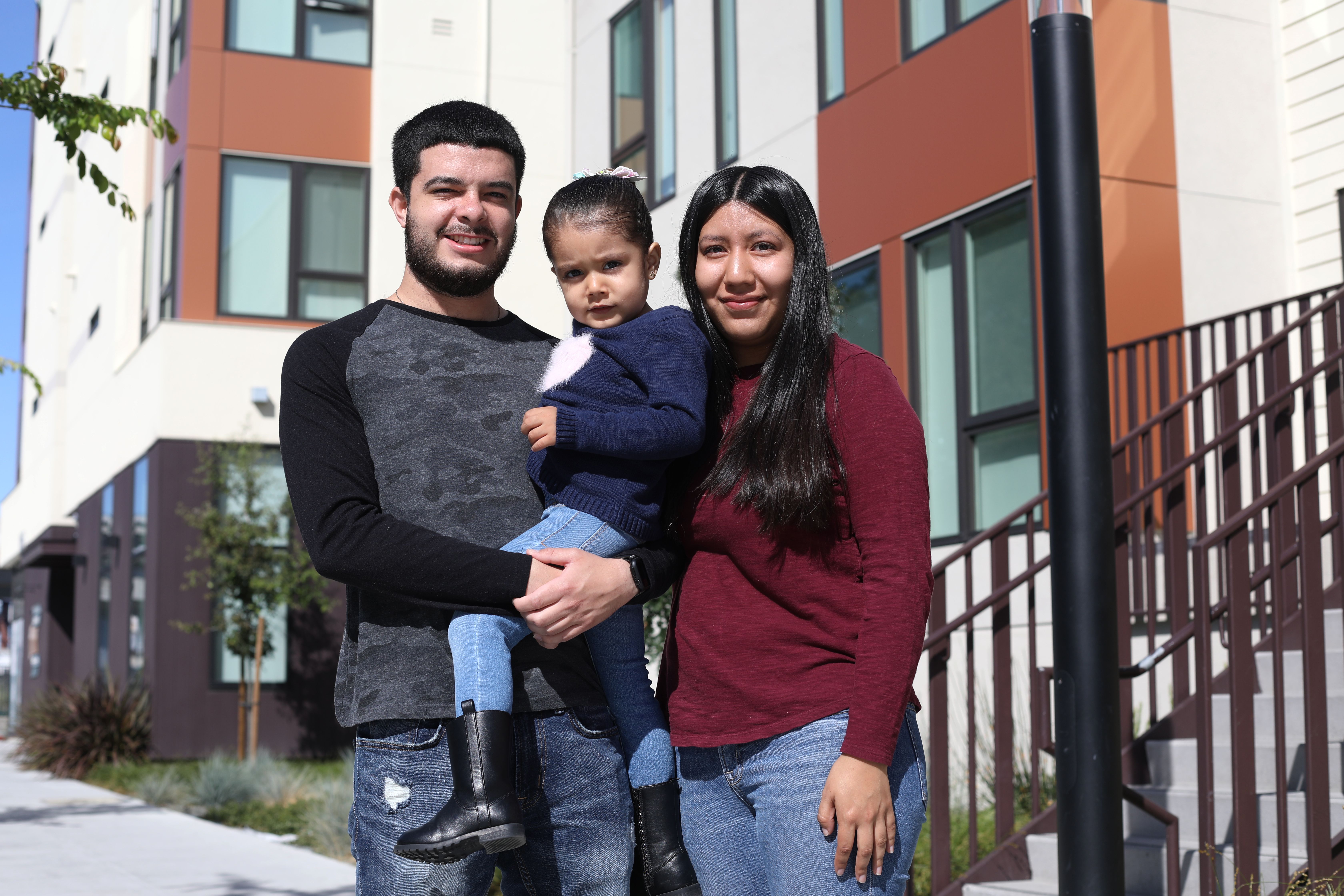 Jesus Barragan and his family photographed outside their apartment building in Oakland