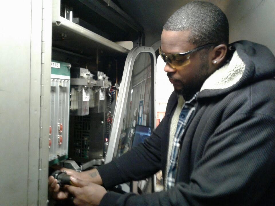 Asberry working in a train cab