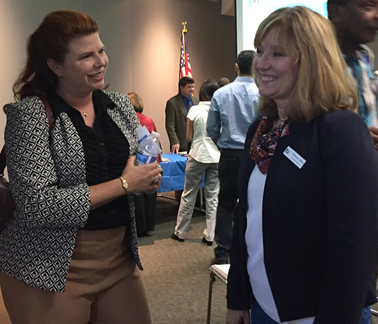 Rachael Keish, left, speaks with District 1 Director Debora Allen