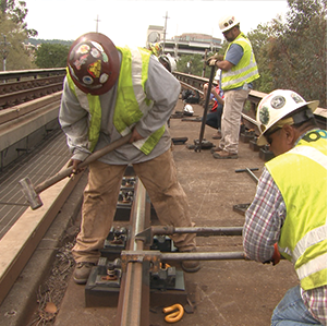 track workers repairing rail