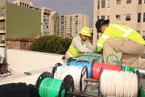 workers installing cable