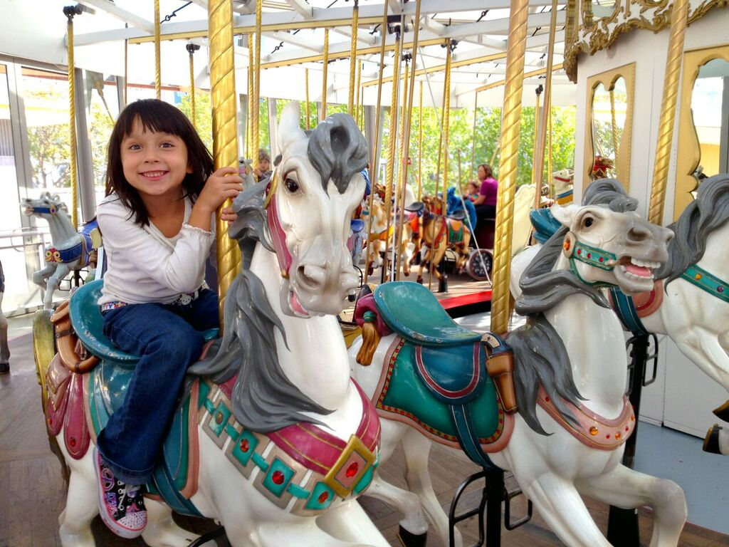 Child on carousel at Children's Creativity Museum