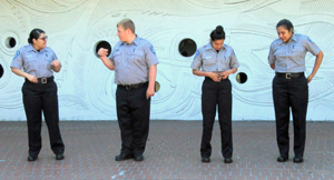 Explorers prepare their uniforms to stand in a line at attention