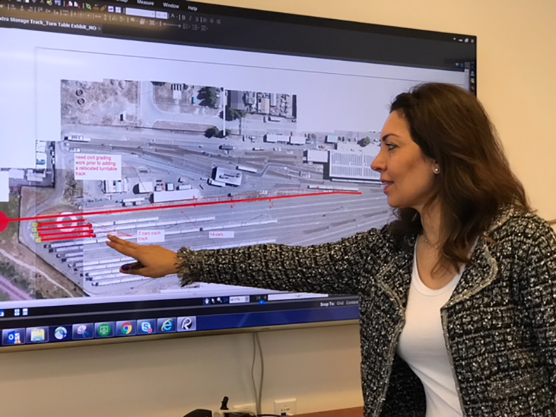 Moheb discusses a Richmond Yard Track Rehabilitation plan in a meeting with her team 