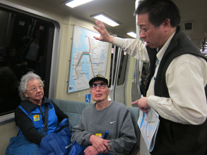 Senior citizens on BART train with tour leader