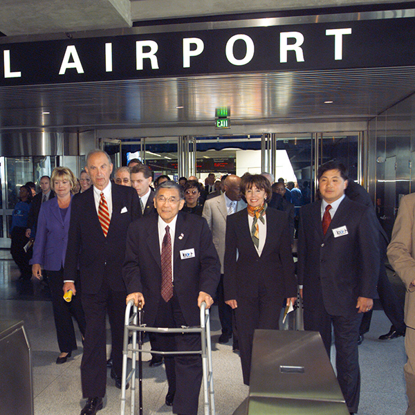 Representative Ellen Tauscher, Judge Quentin L. Kopp, Secretary of Transportation Norman Minetta, U.S. Senator Barbara Boxer, and BART Board Member James Fang enter the new station on opening day.