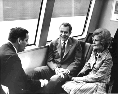 President Richard M. Nixon and his wife, Pat, take a BART ride.