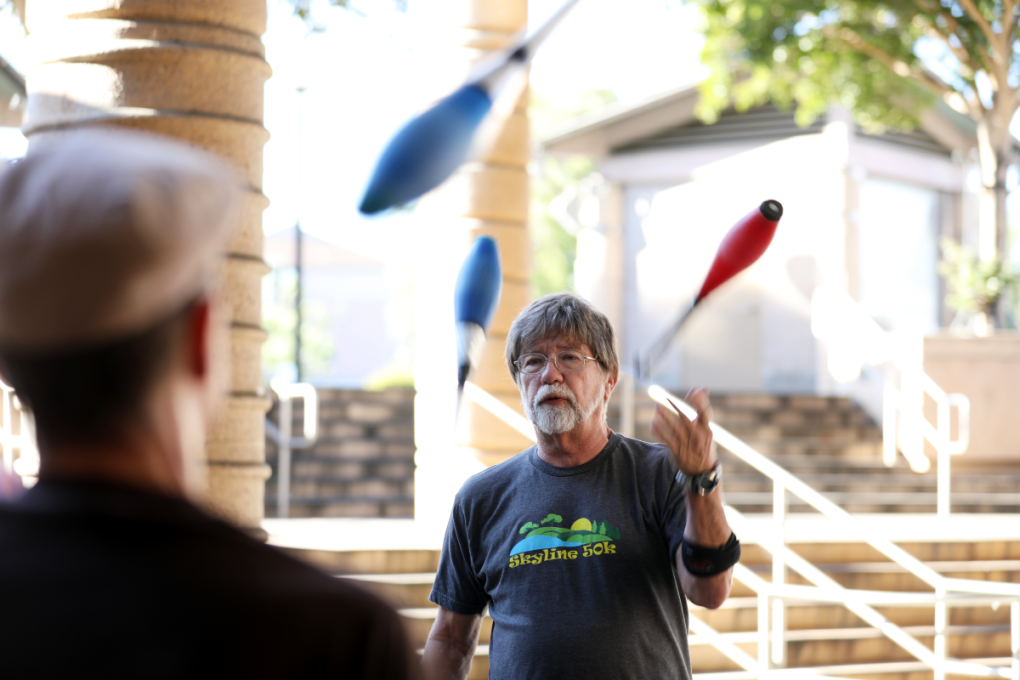 Tony Flusche is pictured juggling at Castro Valley Station during a Tuesday evening meetup in July.