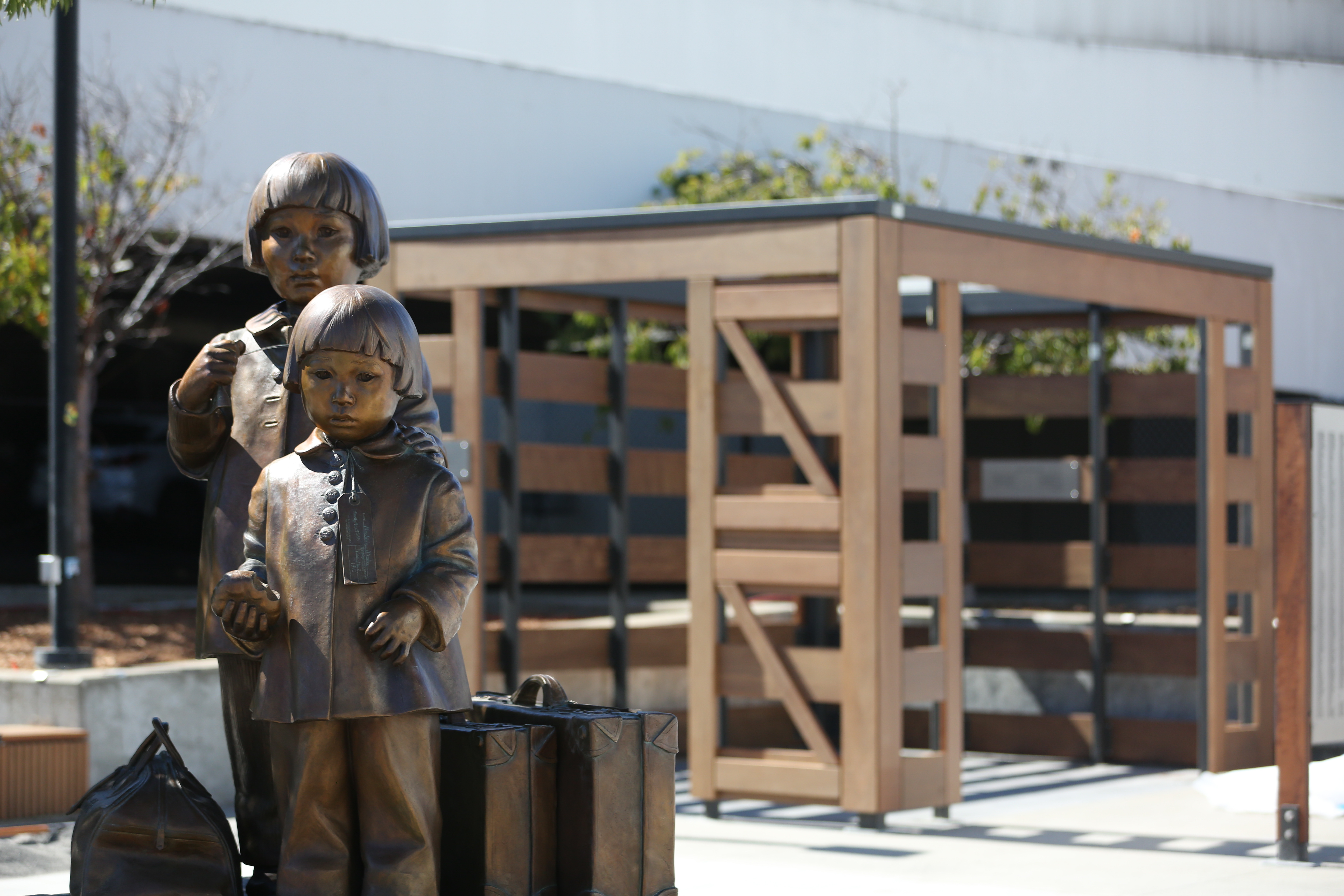 Tanforan Memorial bronze sculpture of two Mochida sisters waiting to be transported to Tanforan