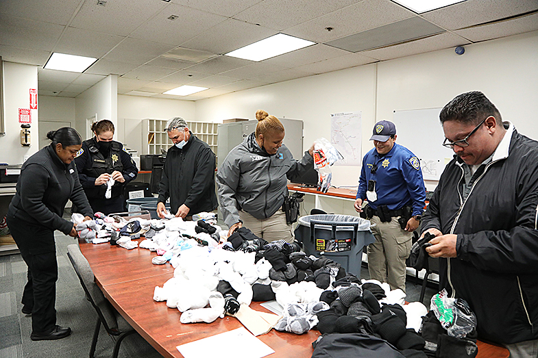 BART PD’s Special Engagement Team gives out free socks to those in need 