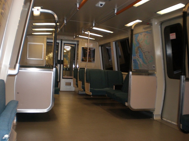 Interior of a C2 car in the days when there was wool upholstery; note the flip-up seat at bottom left, which allowed the seat to