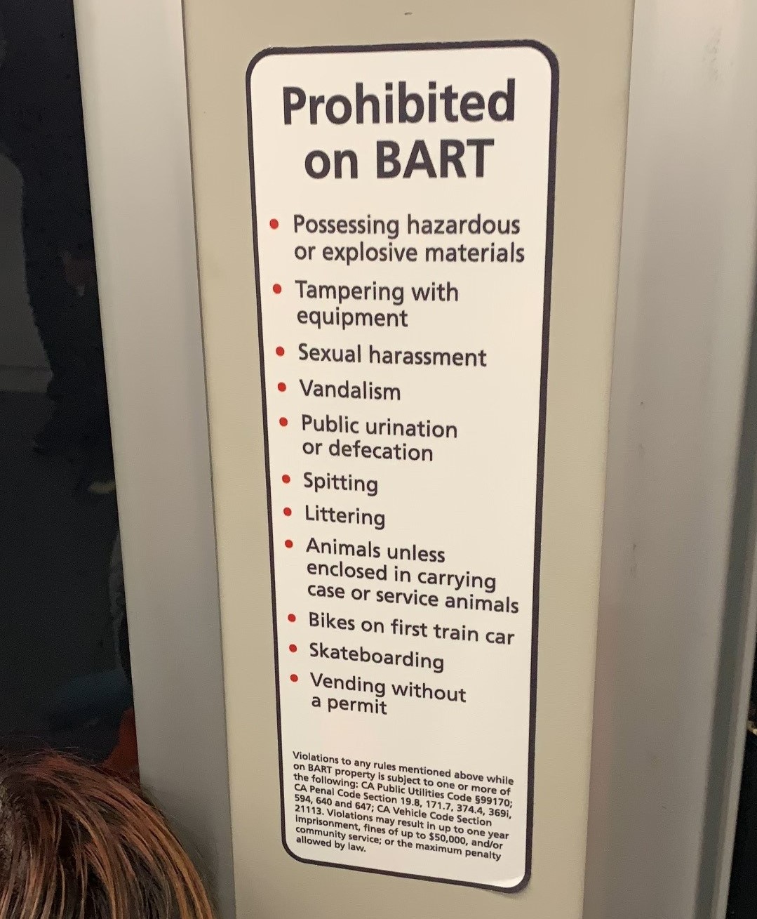 Code of conduct decal on train listing sexual harassment