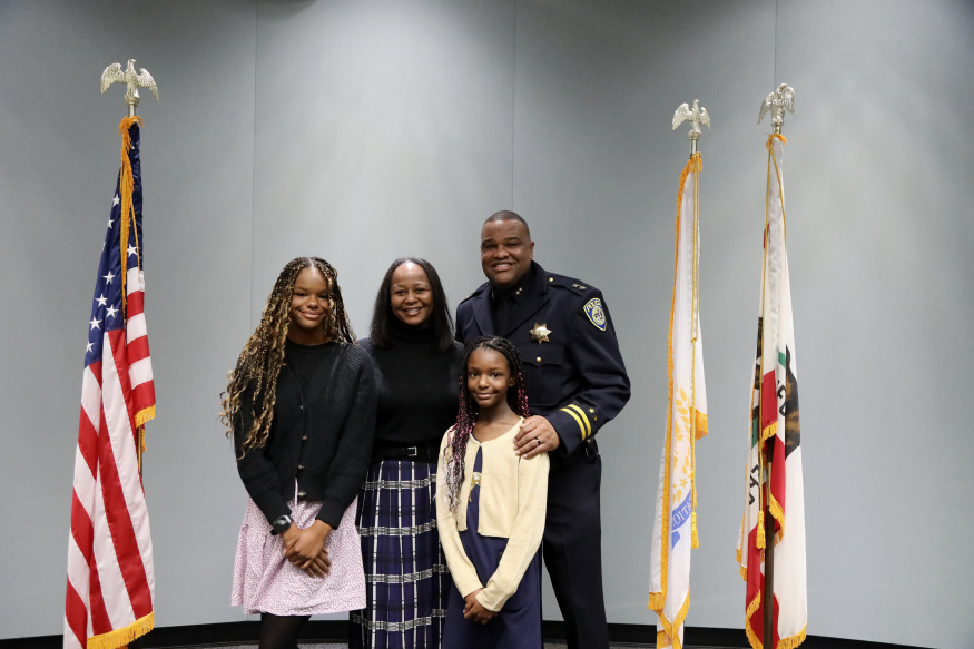 Deputy Chief Ja'Son Scott with his family at his swearing in ceremony