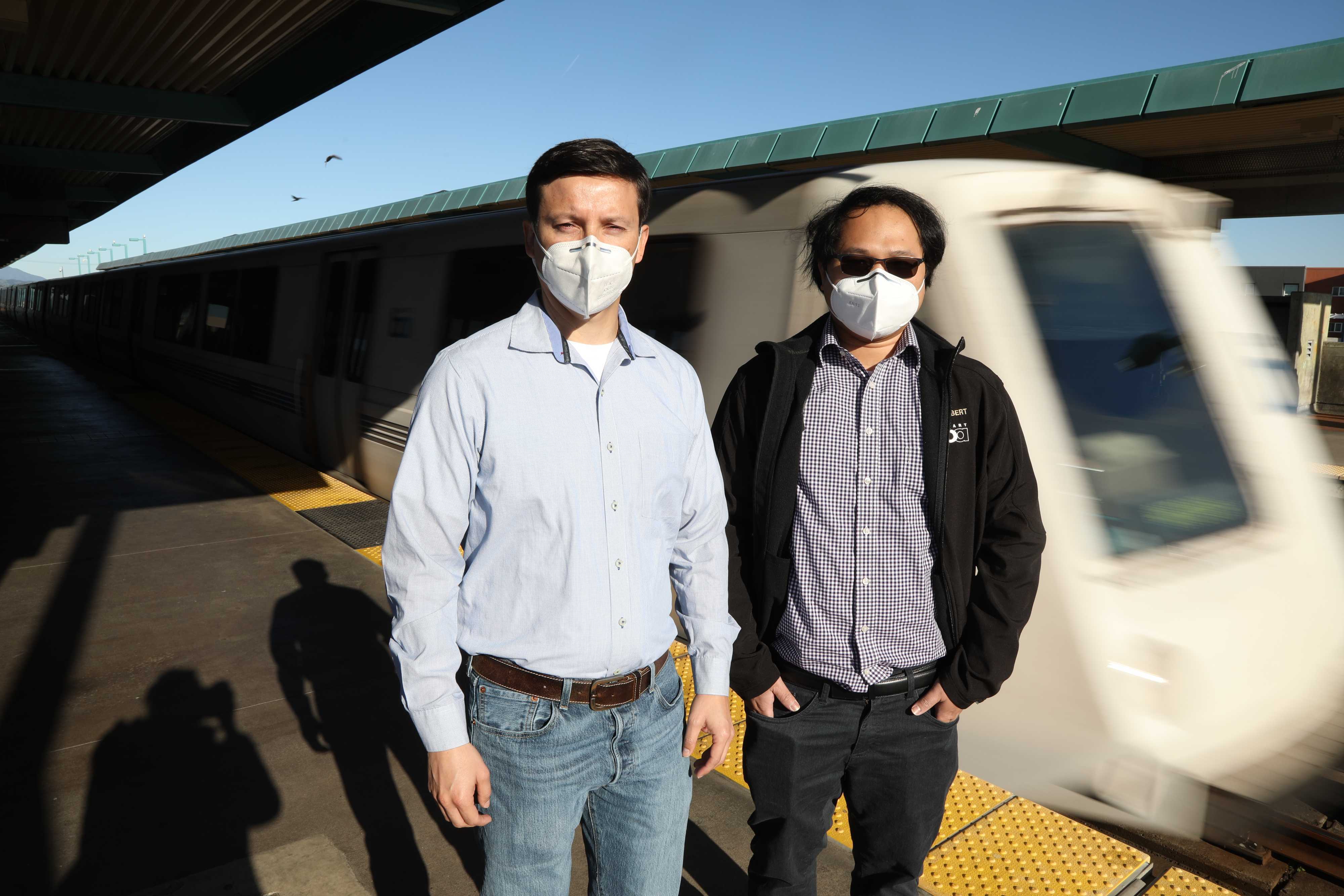 Carlbert Fuertes, left, and Cesar Lopez Servin, right, poses at West Oakland BART station platform