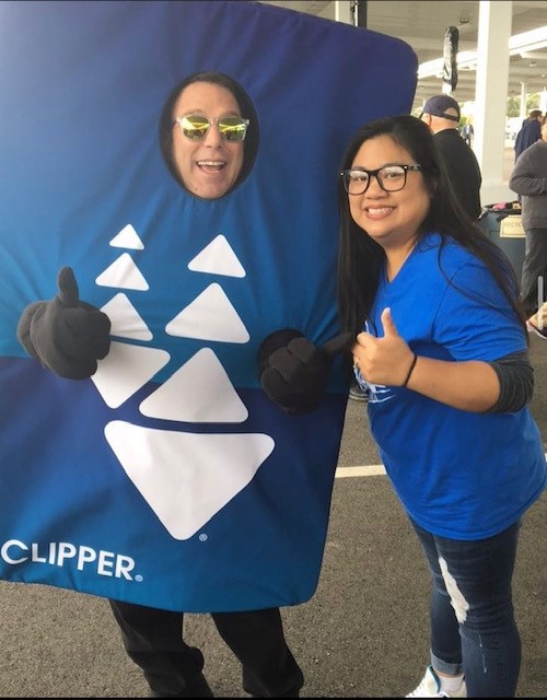 BART Customer Service representative Michelle Pallen-Mendiola poses with the Clipper card mascot