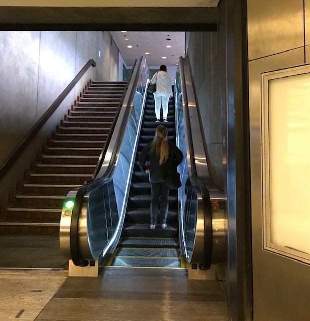 Riders use the rebuilt escalator at Montgomery St. Station 