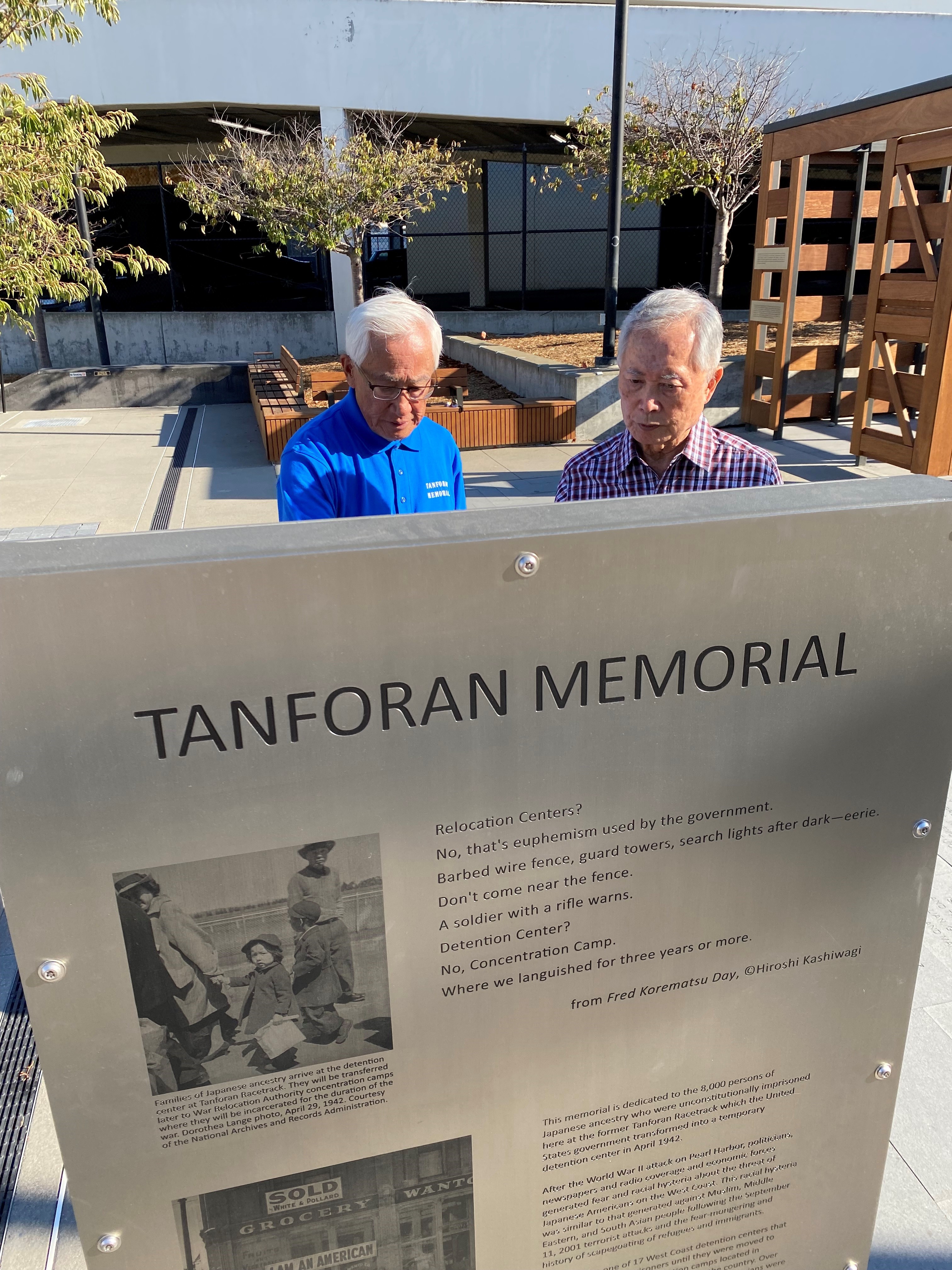 George Takei and Steve Okamoto looking at memorial descriptions