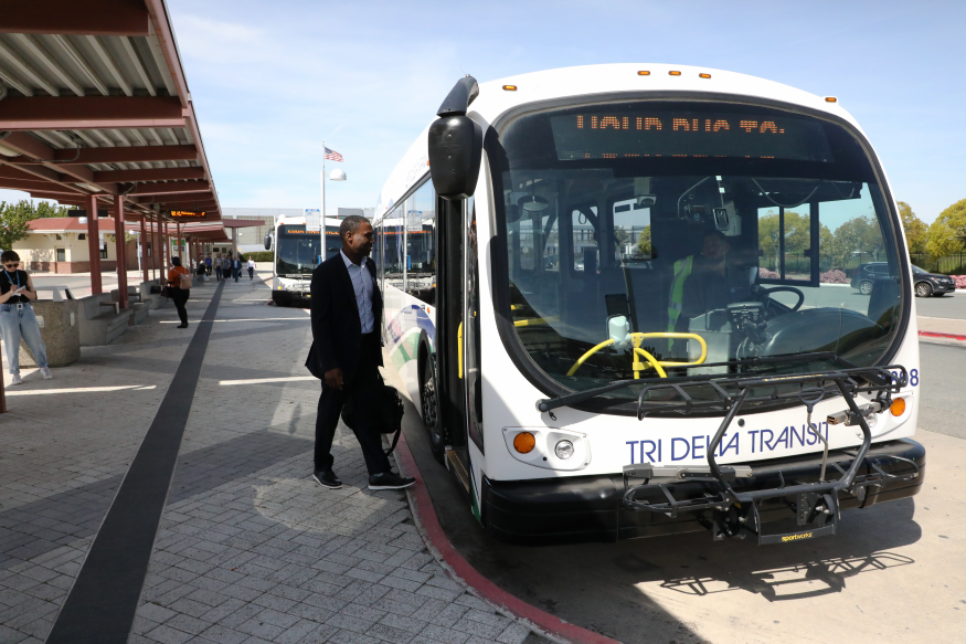 Tri Delta Transit CEO Rashidi Barnes boards the 201X bus.