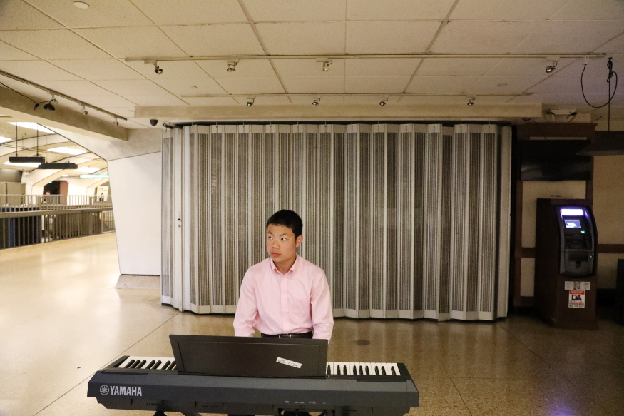 Michael Shuang plays electric piano while performing for Bach in the Subways at Downtown Berkeley Station on March 21, 2023.