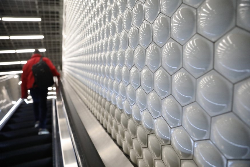 BART's bubble tiles are seen on a wall at Powell St. 