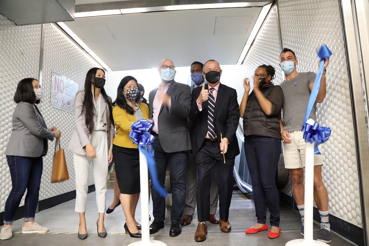 Powell station escalator opens with a ribbon cutting ceremony featuring BART board members and dignitaries