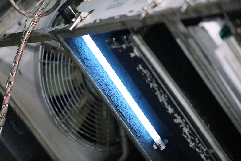 Detail of ultraviolet light (UV-C) mounted inside an HVAC unit as part of a BART pilot project