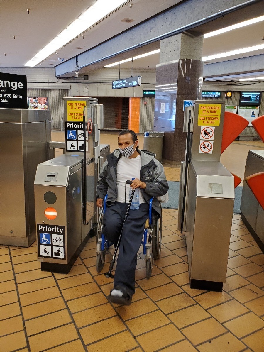 Wheelchaired patron coming through new prototype ADA gate in Richmond Station