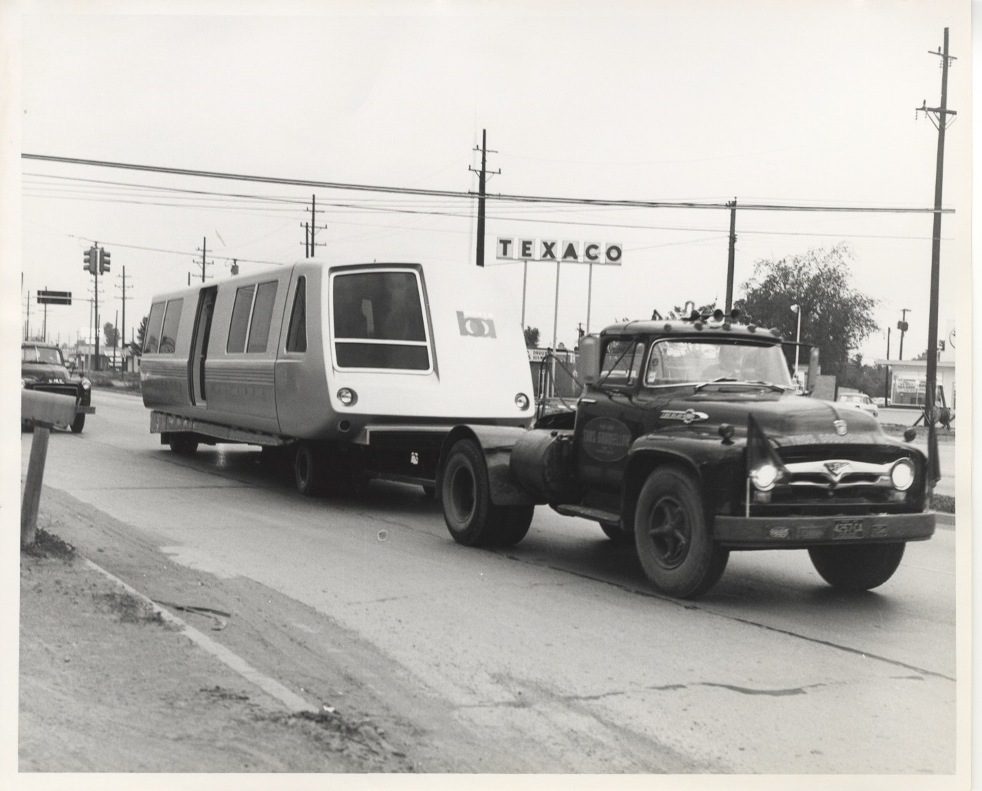 Half of the final BART car prototype traveling on a trailer to California in 1965. Photo courtesy of Sundberg-Ferar.