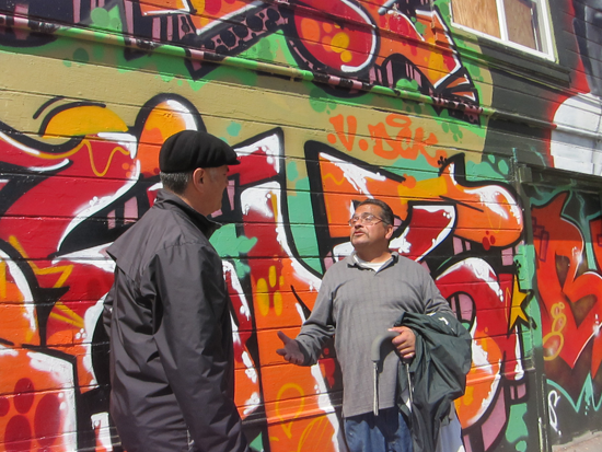 Armando Sandoval talks with a community member