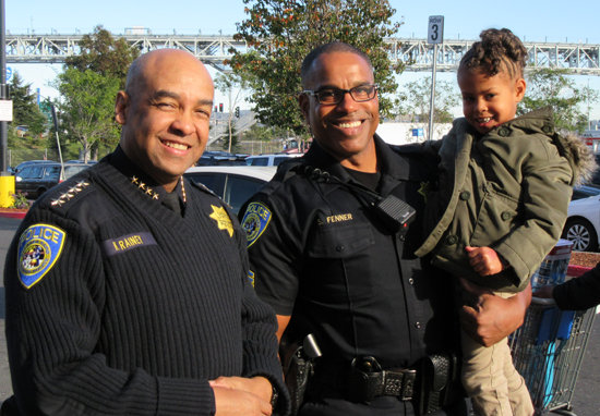 Chief Kenton Rainey, Sgt. Sean Fenner and shopper