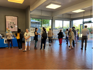 A group of people in a room

AI-generated content may be incorrect.