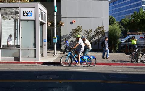 Photo of 2 bicyclists on a street