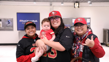 Family in 49ers gear at BART