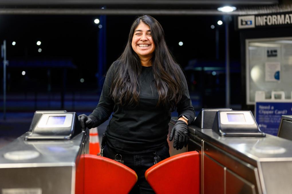 Foreworker Wendy Salazar is pictured behind a fare gate at South Hayward Station. 