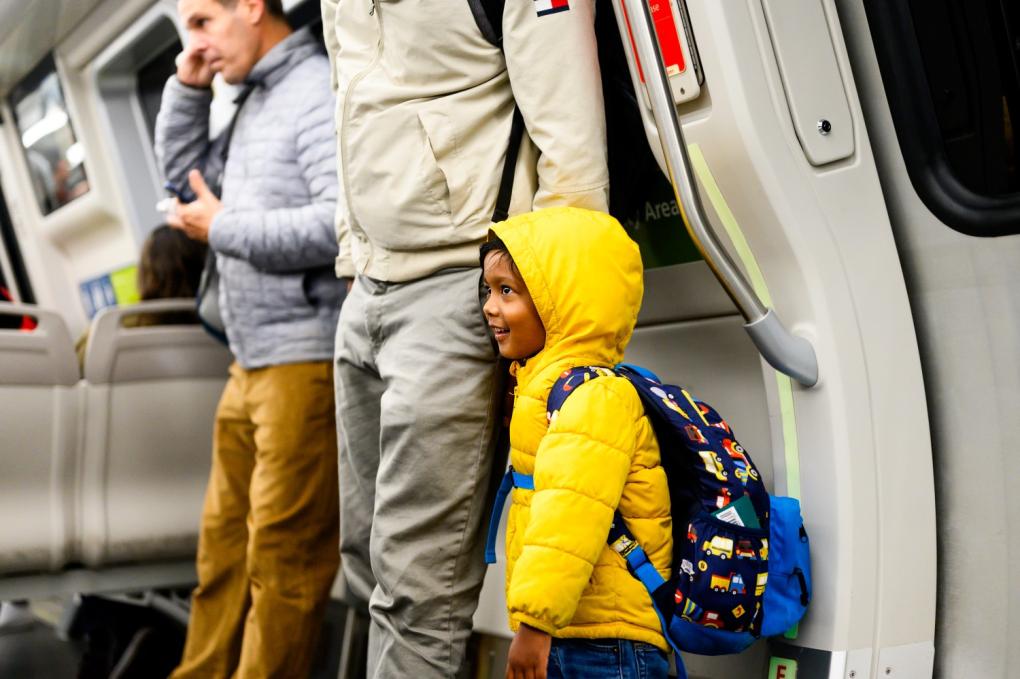 Child in backpack on BART