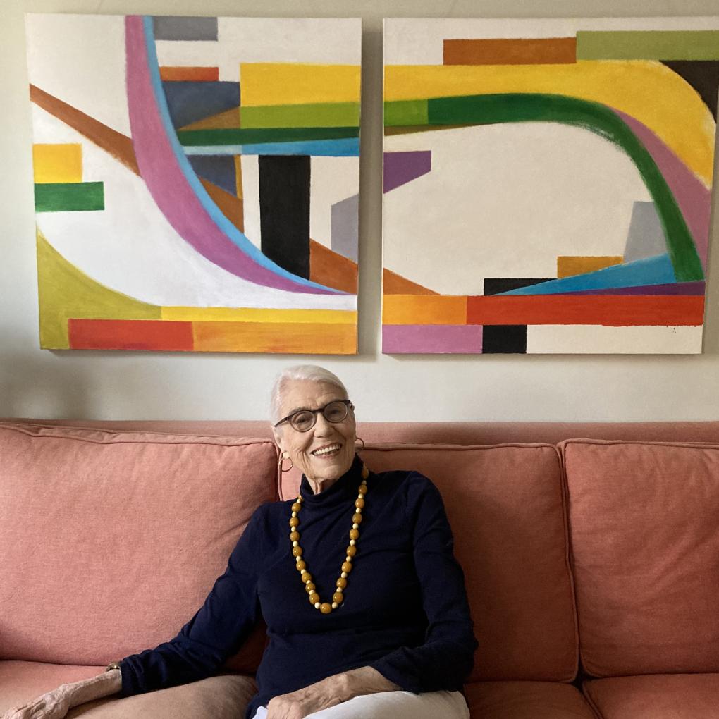 Janet Bennett pictured at home in New York in front of one of her paintings.