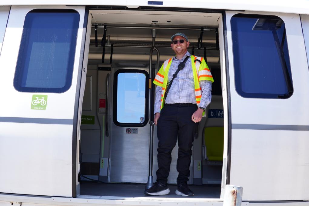 Transportation Supervisor Casey Ungar pictured on a newly accepted Fleet of the Future train car.