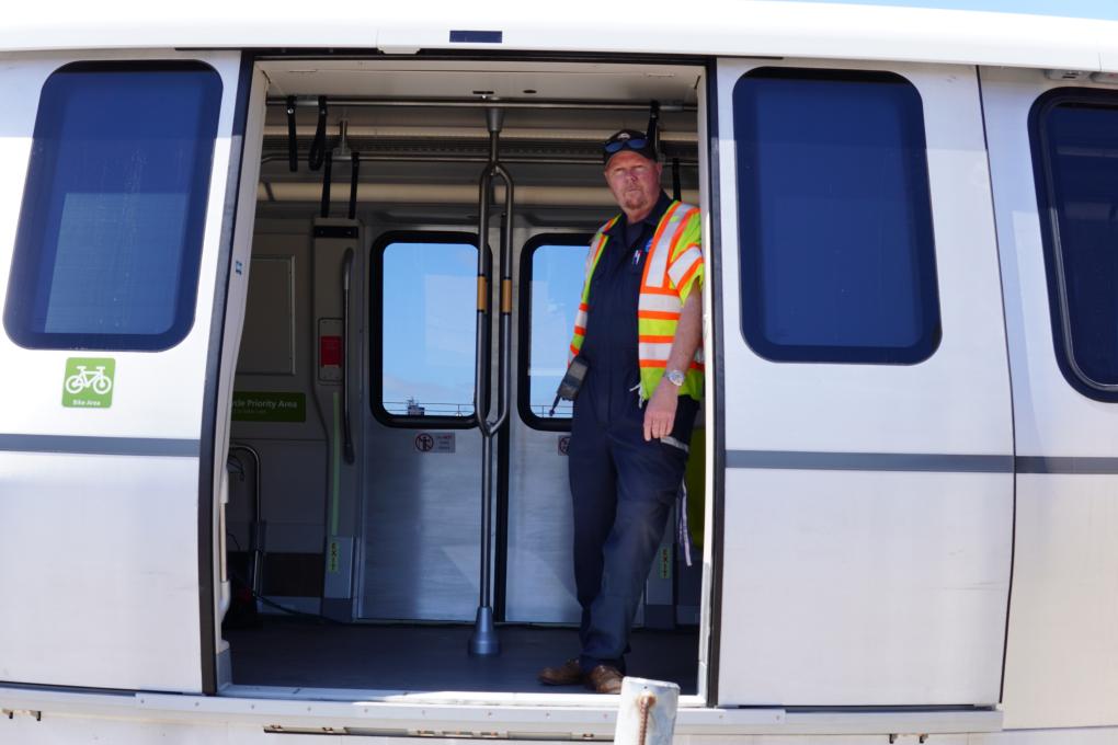 Longtime Test Track Train Operator Kirk Paulsen is pictured in a newly accepted car.
