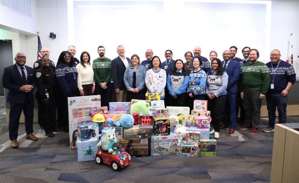 Photo of people during board meeting for the Toy Drive