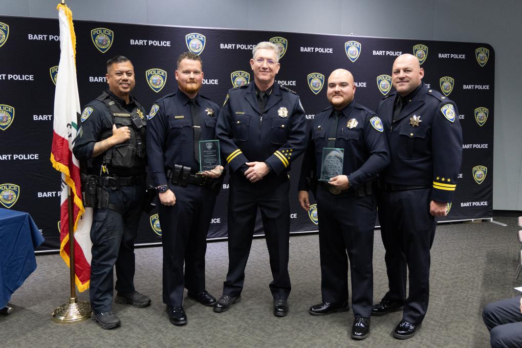A photo of a BPD awards honoree with Chief Kevin Franklin