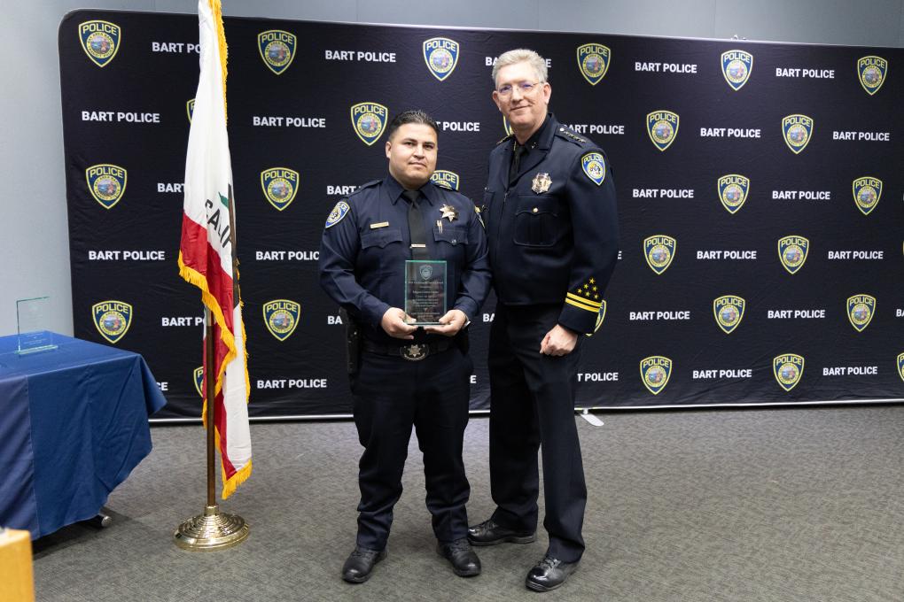 A photo of a BPD awards honoree with Chief Kevin Franklin