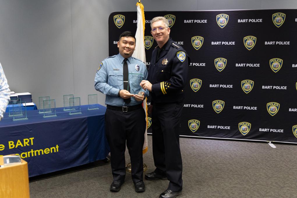A photo of a BPD awards honoree with Chief Kevin Franklin