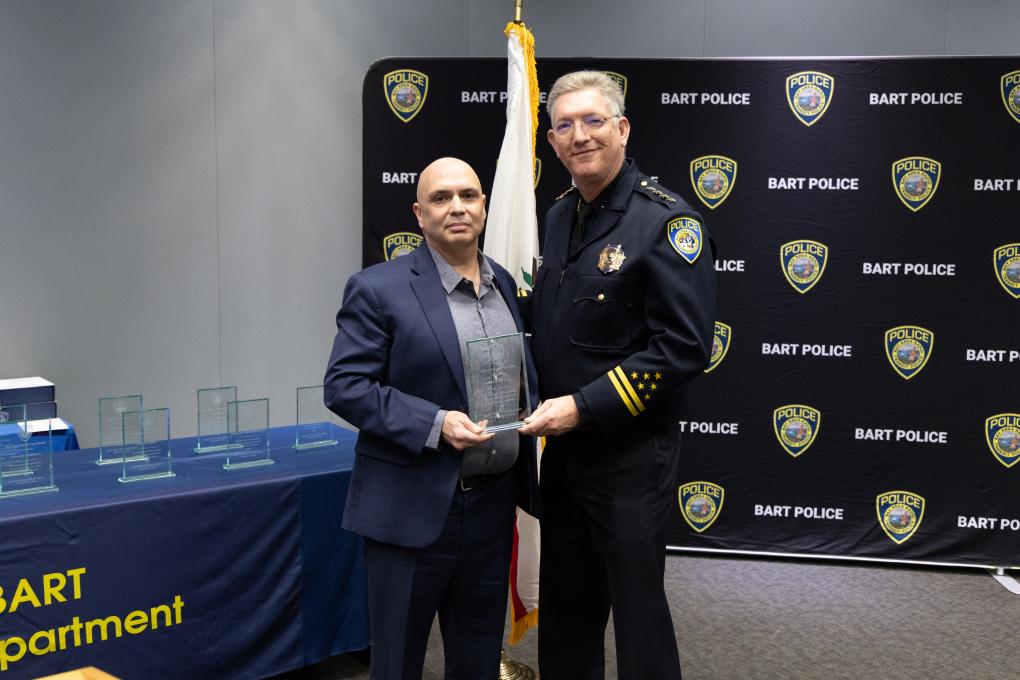 A photo of a BPD awards honoree with Chief Kevin Franklin