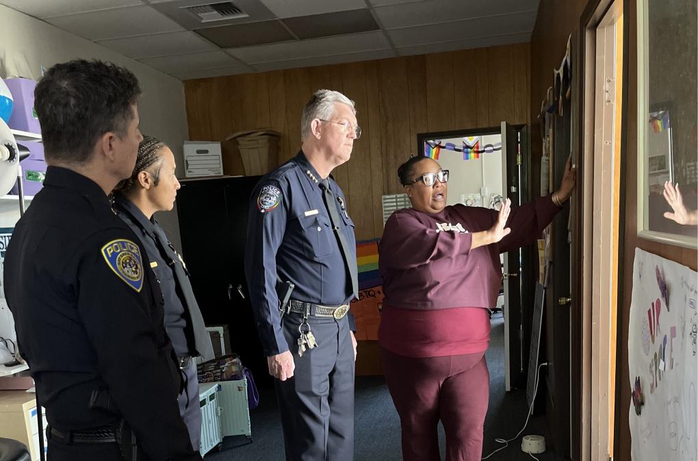 Program Director Myeeka Calhoun takes BART Police on a tour of Side by Side.