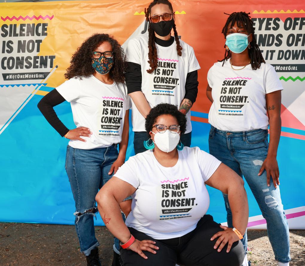 Participants pose for a photo at Not One More Girl's in-person event at Akoma Market in Oakland on April 18. Photo: Stephen Woo